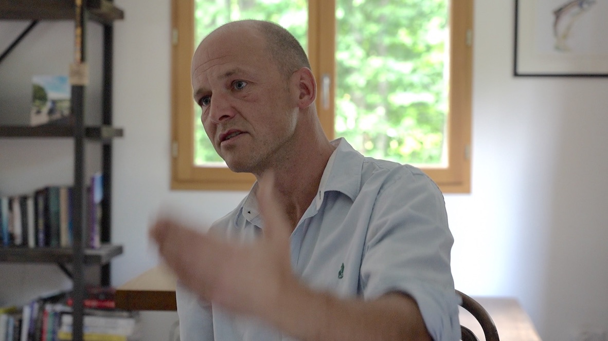 Iain Menmuir speaking with an audience